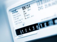 Das Bild zeigt ein digitales Zählermodul mit der Bezeichnung "BK-G4". Es zeigt eine Zählernummer von "10438" und verschiedene technische Angaben zu Durchfluss und Messwerten. Hintergrund und andere Details sind unscharf.